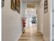 Bright hallway features light wood floors, neutral paint and offers a view into the living area at 8008 Brookbank Dr, Charlotte, NC 28269