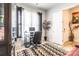 Cozy home office featuring a glass desk, large monitor, and a stylish potted plant for added comfort at 8008 Brookbank Dr, Charlotte, NC 28269