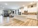 Open-concept kitchen with white cabinets, a center island and stainless steel appliances overlooking the living space at 8008 Brookbank Dr, Charlotte, NC 28269