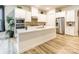 Modern kitchen features white cabinets, a large center island, stainless steel appliances and ample storage space at 8008 Brookbank Dr, Charlotte, NC 28269