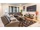 Living room with a large sectional sofa, decorative rug, and large TV at 8008 Brookbank Dr, Charlotte, NC 28269