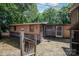 Charming backyard featuring exterior home access, a spacious patio, and stairs that lead to the upper-level balcony at 908 Taylor St, Kannapolis, NC 28083