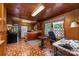 Retro kitchen with wood paneling, unique flooring, and classic appliances at 908 Taylor St, Kannapolis, NC 28083