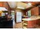 Open kitchen view featuring vintage appliances, custom wood cabinets, and a retro design at 908 Taylor St, Kannapolis, NC 28083