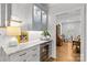 Charming bar area offers a wine fridge, stone countertops and glassware cabinet at 9513 Tresanton Dr, Charlotte, NC 28210