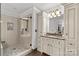 Bathroom features a glass shower, vanity with marble countertops and ample storage at 9513 Tresanton Dr, Charlotte, NC 28210