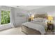 Cozy bedroom with a comfortable bed, large window and natural light at 9513 Tresanton Dr, Charlotte, NC 28210