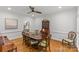 Inviting dining room features a large table, hardwood floors and natural light at 9513 Tresanton Dr, Charlotte, NC 28210