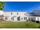Spacious backyard with lush lawn, patio, and playground at 9586 Kartey Nw Ave, Concord, NC 28027