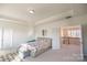Bright primary bedroom with ample natural light, carpet floors, and entry to sitting room/office at 9586 Kartey Nw Ave, Concord, NC 28027