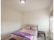 Cozy bedroom with a bed, side table, and a window offering natural light at 9586 Kartey Nw Ave, Concord, NC 28027