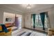 Cozy living room featuring neutral walls, hardwood floors, and large windows at 9586 Kartey Nw Ave, Concord, NC 28027