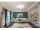 Stylish living room with tray ceiling, elegant furnishings, and large window at 9586 Kartey Nw Ave, Concord, NC 28027