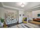 Elegant living room featuring hardwood floors, neutral walls, and decorative shelving at 9586 Kartey Nw Ave, Concord, NC 28027