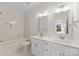 Bright bathroom with double sinks, a soaking tub with tile surround, and brushed nickel fixtures at 9715 Misenheimer Rd # 4B, Charlotte, NC 28215