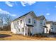 Exterior of newly built townhomes with well-maintained landscaping, integrated garages, and attractive design elements at 9715 Misenheimer Rd # 4B, Charlotte, NC 28215