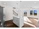 Open kitchen featuring a center island, stainless steel appliances, white cabinetry, and modern pendant lighting at 9715 Misenheimer Rd # 4B, Charlotte, NC 28215