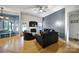 Bright living room with hardwood floors, a fireplace, and stylish furniture, perfect for relaxation at 1021 Stinson Glen Ln, Charlotte, NC 28214