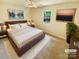 Cozy bedroom with a ceiling fan, a window, and neutral tones, virtually staged with modern decor at 10701 Copper Field Dr, Pineville, NC 28134