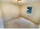 Comfortable bedroom with a window providing natural light at 10701 Copper Field Dr, Pineville, NC 28134