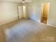 Cozy bedroom with neutral walls, carpet and ceiling fan at 10701 Copper Field Dr, Pineville, NC 28134