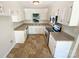 Bright kitchen featuring white cabinets, stainless steel appliances, and light countertops at 10701 Copper Field Dr, Pineville, NC 28134