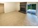 Spacious living room with a brick fireplace and sliding glass doors to a patio at 10701 Copper Field Dr, Pineville, NC 28134