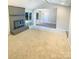 Inviting living room with a brick fireplace and sliding glass doors to the backyard at 10701 Copper Field Dr, Pineville, NC 28134