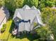 Aerial view showcases the home's roofline, back deck, screened in porch, and large backyard at 11224 Warfield Ave, Huntersville, NC 28078