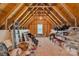 Spacious attic features exposed wood beams, a window, and ample storage with organization options at 11224 Warfield Ave, Huntersville, NC 28078