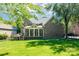 Expansive backyard with lush lawn, screened porch, and wooden deck perfect for outdoor living at 11224 Warfield Ave, Huntersville, NC 28078
