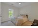 Inviting bedroom features a soft bed, window with natural light for a cozy feel at 11224 Warfield Ave, Huntersville, NC 28078