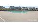 Community pool with ample deck space and surrounding neighborhood homes at 11224 Warfield Ave, Huntersville, NC 28078