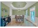 Elegant dining room with a decorative ceiling, wainscoting, and abundant natural light at 11224 Warfield Ave, Huntersville, NC 28078