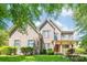 Charming two-story brick home with well-maintained landscaping and inviting front porch at 11224 Warfield Ave, Huntersville, NC 28078