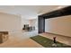 Large game room with golf simulator, and game table with chairs near to the window at 11224 Warfield Ave, Huntersville, NC 28078