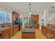 Charming kitchen with granite countertops, stainless steel appliances, and wood cabinets at 11224 Warfield Ave, Huntersville, NC 28078