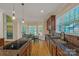 Bright kitchen featuring granite countertops, stainless steel sink, and dining table by the window at 11224 Warfield Ave, Huntersville, NC 28078