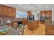 Well-equipped kitchen features granite counters, stainless appliances, and an adjacent dining area at 11224 Warfield Ave, Huntersville, NC 28078