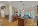 Open-concept kitchen featuring granite countertops, wood cabinets, and eat-in dining area at 11224 Warfield Ave, Huntersville, NC 28078