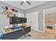 A bright office features natural light from the windows and a ceiling fan at 11224 Warfield Ave, Huntersville, NC 28078
