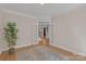 Cozy office with hardwood floors, ample natural light, and a view of the staircase at 11224 Warfield Ave, Huntersville, NC 28078