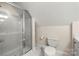 Bathroom featuring a shower with glass sliding doors, a toilet and tiled floors at 11510 Pine Valley Club Dr, Charlotte, NC 28277