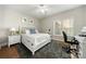 Bright bedroom with a cozy area rug, white furniture set and a chair near window offering natural light at 11510 Pine Valley Club Dr, Charlotte, NC 28277