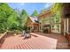 Spacious wooden deck with comfortable seating and a grill, perfect for outdoor entertaining at 11510 Pine Valley Club Dr, Charlotte, NC 28277