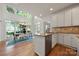 Kitchen with stainless steel appliances, granite countertops, an island, and a view of the dining area at 11510 Pine Valley Club Dr, Charlotte, NC 28277
