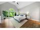 Spacious bedroom boasts vaulted ceiling, large window and natural light at 11510 Pine Valley Club Dr, Charlotte, NC 28277