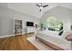 Bright main bedroom boasts vaulted ceiling, a tv, and access to deck at 11510 Pine Valley Club Dr, Charlotte, NC 28277