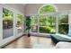 Sunroom features french doors, window view to deck and lush back yard at 11510 Pine Valley Club Dr, Charlotte, NC 28277