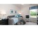 A cheerful bedroom with a daybed, soft blue accents, and natural light, perfect for a or guest at 11913 Casabella Dr, Huntersville, NC 28078